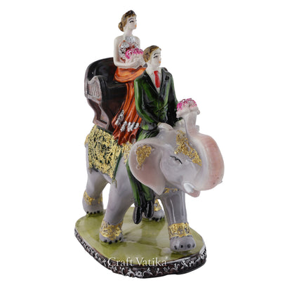 Resin Couple Sitting on Elephant Decorative Showpiece